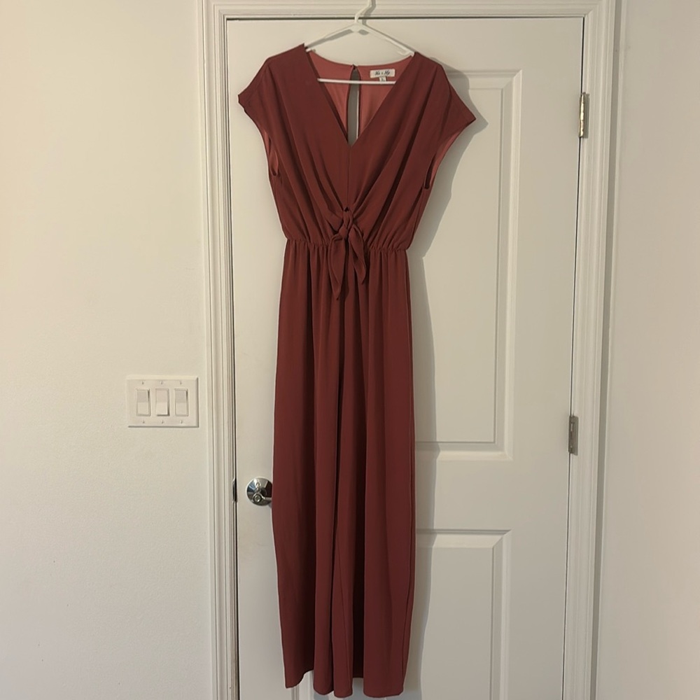 A deep salmon long pants romper